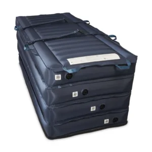 Blue multi-chamber inflatable mattress with external handles and valve ports, stacked in a column and folded for storage.