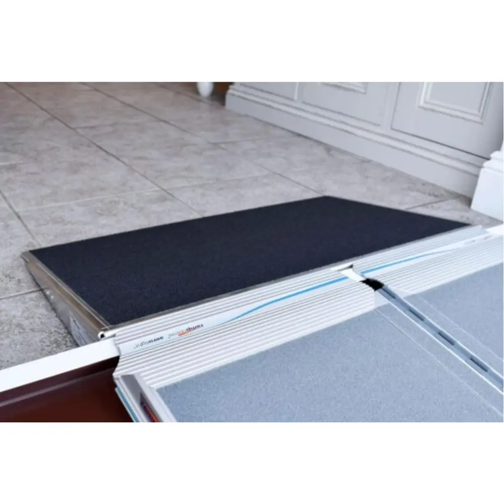 Doorline Threshold Wedge4 - O Neill Healthcare Aluminum doorway ramp with grooved edge and dark non-slip surface for wheelchair or stroller access at an entryway