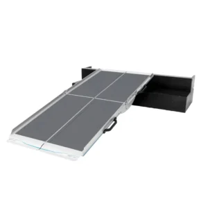 Portable wheelchair ramp extended, gray non-slip surface with a black storage box at the end.